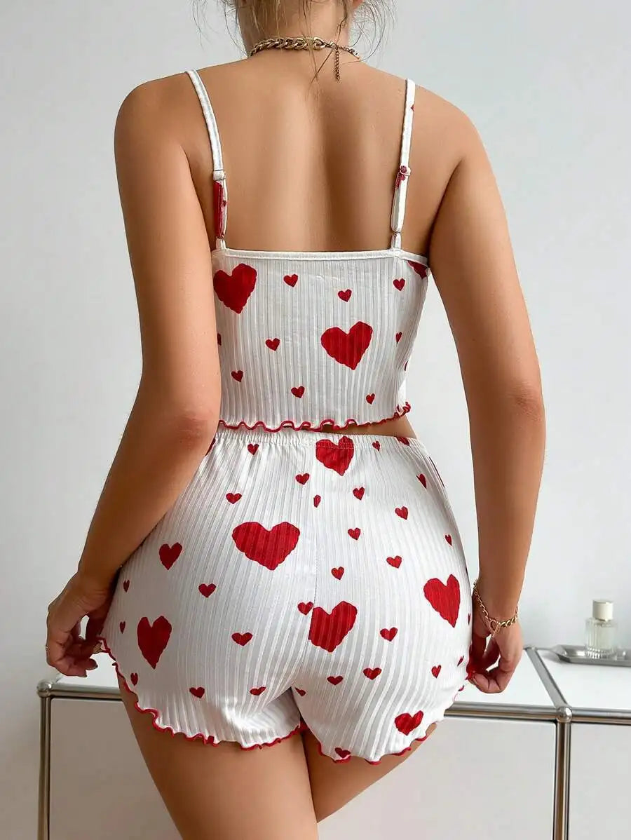 Women's summer pajamas set with heart print, featuring a soft tank top and shorts for comfortable sleepwear.