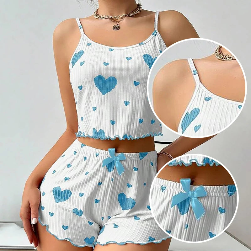 Women's summer pajamas set with tank top and shorts in white with blue hearts, perfect for warm nights.