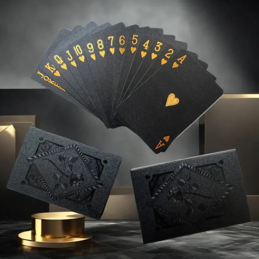 Waterproof black playing cards in a fan display, showcasing unique heart and spade designs, perfect for poker and magic games.