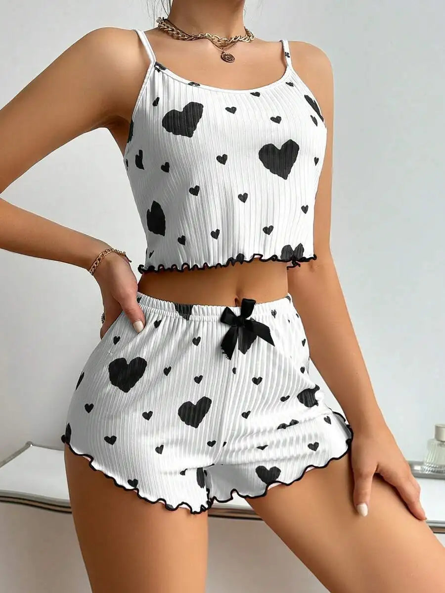 Women's summer pajamas set featuring a sleeveless heart-patterned tank top and matching shorts for comfortable sleepwear.